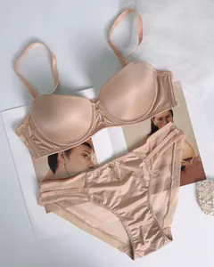 Detail view of seamless satin lingerie set with push-up bra and mesh panelled panties