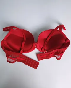 Detail of red seamless push-up bra featuring breathable mesh wings and adjustable straps