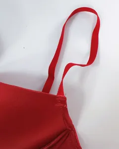 Macro shot of red seamless bra showing refined stitching and smooth satin fabric detail