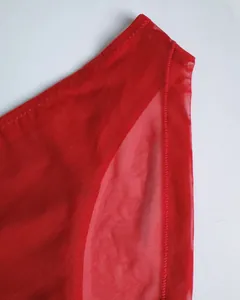 Close-up of red sheer mesh fabric with detailed stitching on seamless lingerie