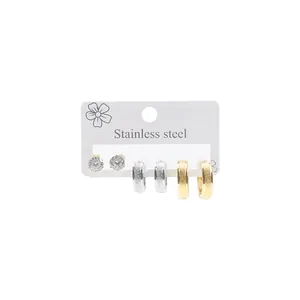 Three-pair stainless steel earring set with zircon studs and textured hoop details