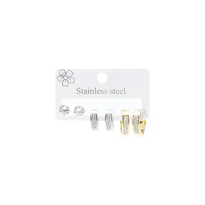 Detailed set of stainless steel stud and hoop earrings with sparkling crystal accents