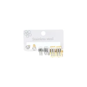 Three pairs of stainless steel earrings with cubic zirconia on a white card display