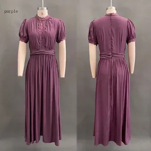 Detailed view of purple V-neck maxi dress with lace stitching and pleated waist design