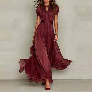 Detail of the high-neck cutout and delicate lace embroidery on a burgundy maxi dress