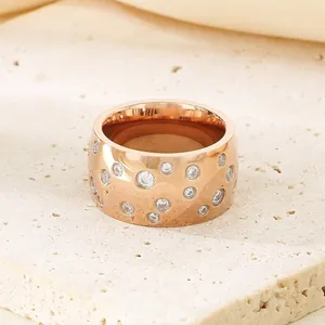 Elegant rose gold titanium steel wide band ring featuring scattered sparkling cubic zirconia stones