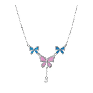 Elegant silver necklace with enamel butterfly and bow pendants with crystal accents