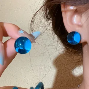 Vibrant dopamine blue sphere stud earrings for a sweet summer fashion look