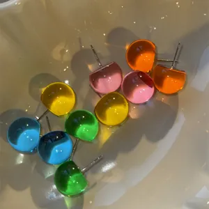 Detailed view of colorful dopamine-style translucent ball stud earrings in various shades