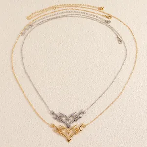 Close-up view of vintage thorny heart pendants on delicate gold and silver body chains