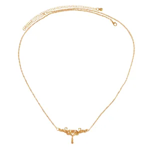 Detailed view of a vintage gold waist chain with an intricate thorn heart filigree design