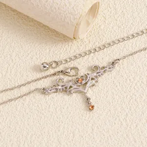 Detailed macro view showing the intricate thorn heart design of this silver body chain