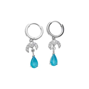 Elegant silver hoop earrings with zircon moon and blue water-drop pendants.