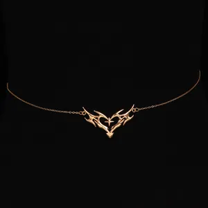 Close-up of gold thorny heart waist chain with a star detail for a chic beach look