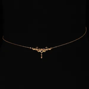 Detailed view of vintage gold thorn heart waist chain for bikini or dress