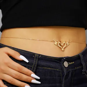 Detailed close-up of a golden thorn heart waist chain with star accent on skin
