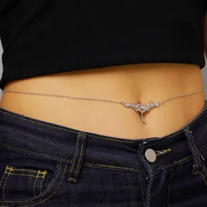 Close-up detail of a gothic style thorn heart waist chain on a female model's waist