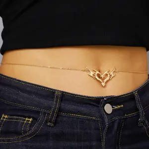 Detailed close-up view of a golden thorny heart waist chain on a female model's waist.