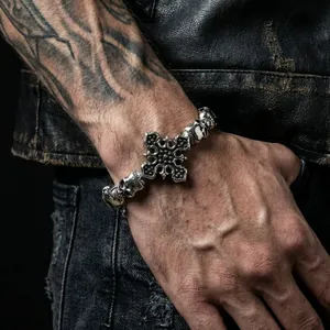 Macro view of gothic skull bracelet with cross detail and vintage silver finish