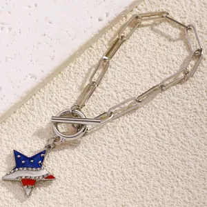 Detailed view of silver paperclip chain bracelet with rhinestone star charm and OT toggle clasp