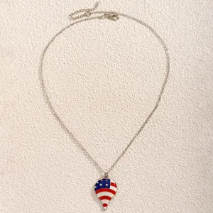 Detail of hot air balloon pendant with American flag pattern on silver chain