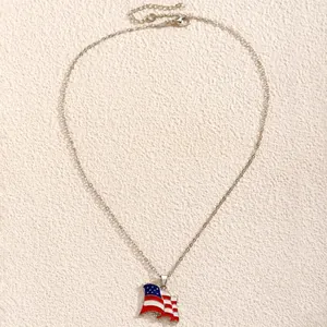 Macro detail of silver lobster clasp and adjustable chain on American flag heart necklace
