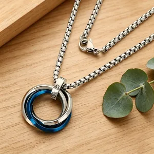 Detailed view of triple-ring interlocking pendant necklace with blue and silver rings