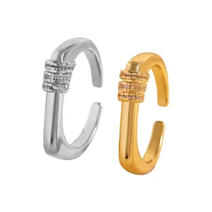 Close-up of gold and silver ear cuffs with triple rows of pavé-set white cubic zirconia