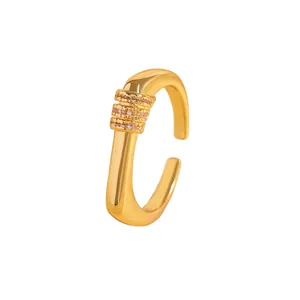 Detail of a gold-plated ear cuff featuring pink zircon stones in a triple row design
