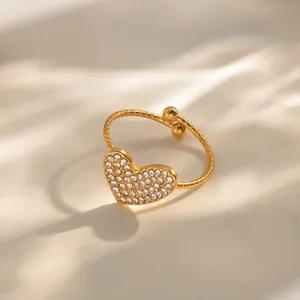 Elegant gold open ring featuring a sparkling pave-set heart with twisted band texture
