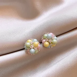 Detailed close-up of dopamine style earrings with pastel acrylic beads and small rhinestones