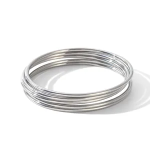 A set of five polished silver-tone stainless steel minimalist slim plain bangles