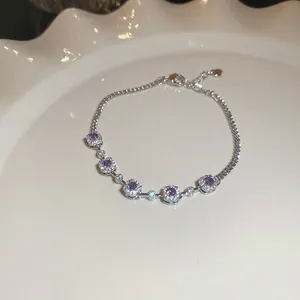 Macro detailed view of the elegant purple zircon bracelet featuring sparkling halo settings