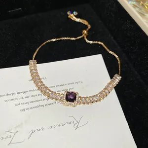 Elegant French vintage gold-tone bracelet featuring a central purple square zircon stone