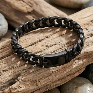 Close-up of matte black stainless steel Cuban link bracelet for men with secure clasp