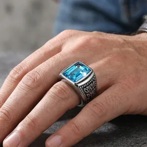 Vintage stainless steel ring for men with large rectangular blue gemstone and leaf engravings