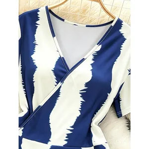 Women's V-neck dress featuring blue and white tie-dye stripe pattern on soft fabric