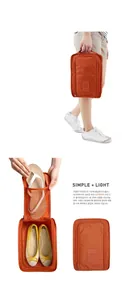 Detail view of orange waterproof travel shoe bag showing internal mesh pocket and dual capacity