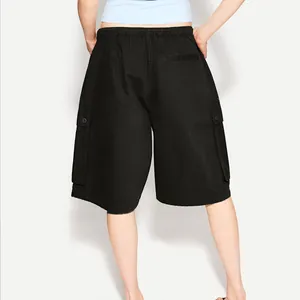 Back view of black cargo shorts with elastic waist and buttoned utility flap pockets