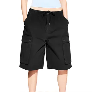 Detail view of black cargo shorts featuring elastic drawstring waist and large flap pockets