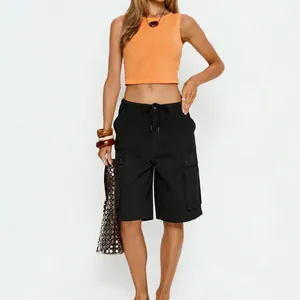 Detail of black cargo shorts with large side pockets and drawstring waist for women