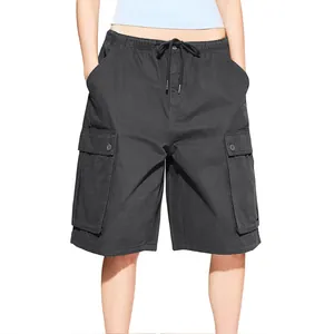 Detail of dark charcoal cargo shorts featuring tactical side pockets and elastic drawstring waist