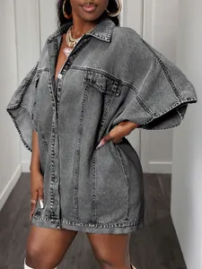 Close-up of oversized acid wash gray denim jacket with cargo chest pockets and metal buttons