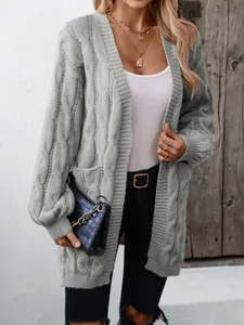 Women's light grey cable knit cardigan in a mid-length oversized retro cable weave style