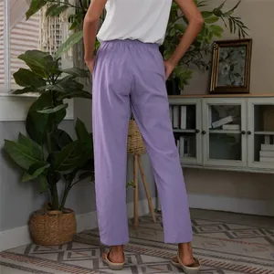 Relaxed fit light purple linen trousers with elastic waist and pockets for women
