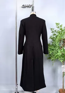 Back view of slim fit black wool coat with center seam and high-slit long hem