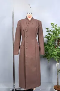 Detail view of the standing collar and side-button closure on this dark brown wool coat