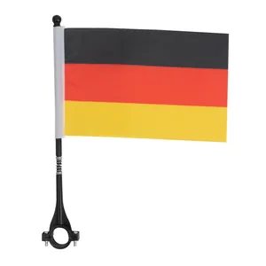 Detail of German flag on flexible spring pole with adjustable handlebar mounting clamp