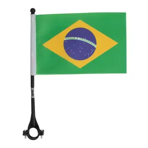 Detail of Brazil flag on bicycle handlebar with spring buffer pole and secure clamp