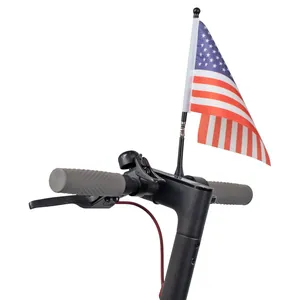Close-up of USA mini flag with flexible spring pole mounted on electric scooter handlebar
